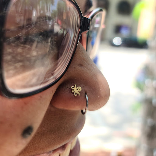 Explore tramp stamp tattoo cover up ideas, creative tattoo ideas in Toledo, available at Piercings by Caitlin presents Holier Toledo