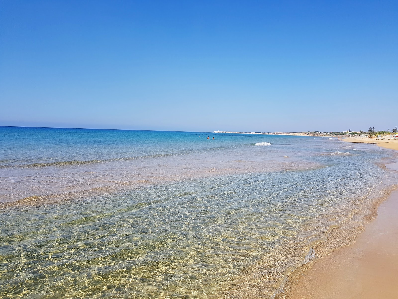 Fotografie cu Plaja Carratois cu o suprafață de nisip maro