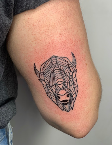 Explore scale tattoo ideas, creative tattoo ideas in Milwaukee, available at The Skin Museum