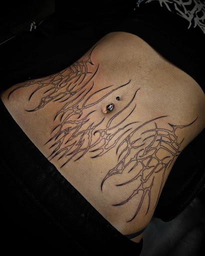 Explore biomechanical tattoo ideas, creative tattoo ideas in Palm Harbor, available at Angry Owl Tattoo and Piercing