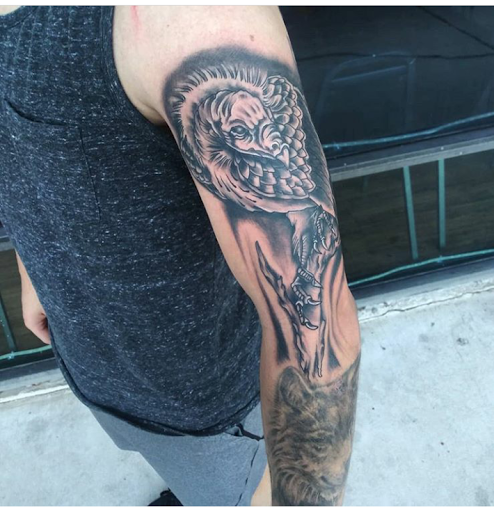 Explore mens elbow tattoo ideas, creative tattoo ideas in Atlantic Beach, available at The Ink Chamber Tattoo Parlor