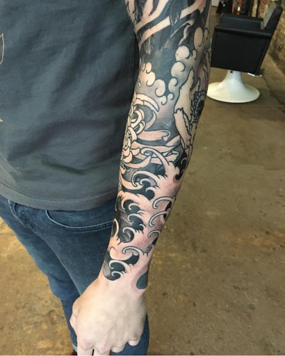 Explore grinch tattoo ideas, creative tattoo ideas in Lexington, available at Charmed Life Tattoo