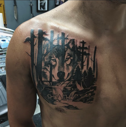 Explore sniper tattoo ideas, creative tattoo ideas in Stevens Point, available at Black Rabbit Tattooing