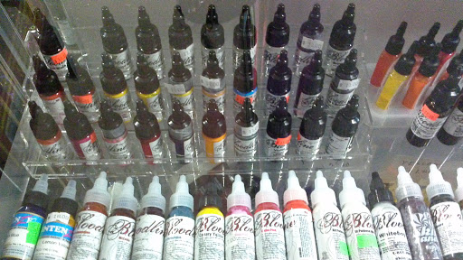 Explore elegant spine tattoo ideas, creative tattoo ideas in Chanute, available at The Hillbillies Store