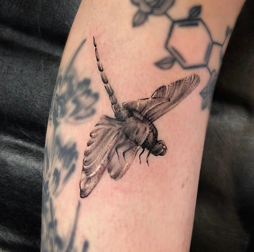 Explore teaching tattoo ideas, creative tattoo ideas in Edison, available at Tattoo Asylum