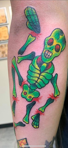 Explore ripped skin tattoo ideas, creative tattoo ideas in Marietta, available at Lure Tattooing & Piercing LLC