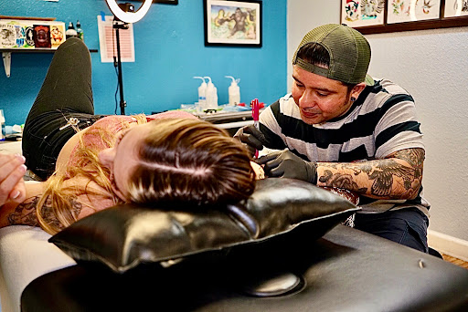 Explore filler sleeve tattoo ideas, creative tattoo ideas in Ventura, available at Famous Tattoo & Body Piercing