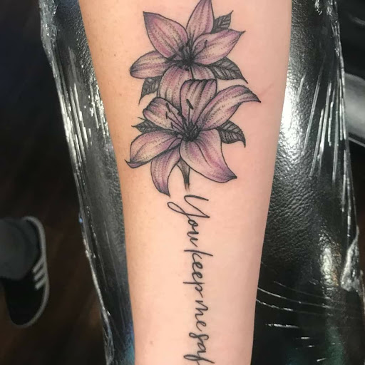 Explore sticker sleeve tattoo ideas, creative tattoo ideas in Reno, available at Evolution Tattoo