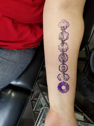 Explore mens wedding ring tattoo ideas, creative tattoo ideas in Madison, available at Dark Matter Tattoo Gallery