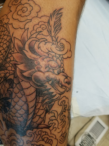 Explore bookworm tattoo ideas, creative tattoo ideas in Bayville, available at Hot Rod INKIN Tattoos, Piercing & Permanent Cosmetics