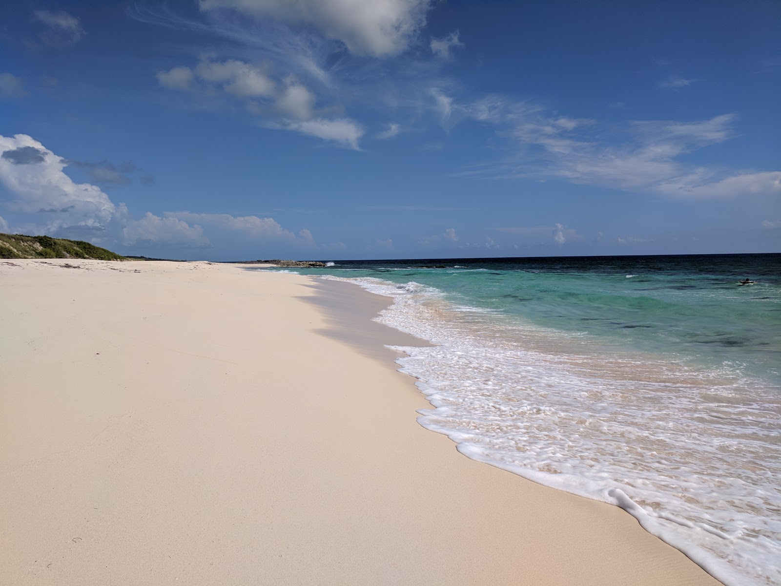 Fotografija Surfer's beach z svetel fin pesek površino