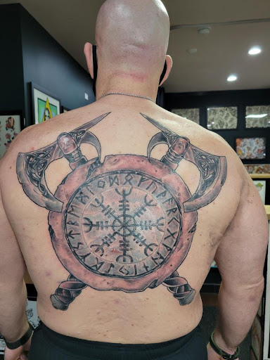 Find dino tattoo ideas for your next unique tattoo in Libertyville at Lucky Seven Tattoo