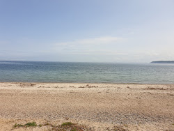 Photo de Oster Beach entouré de montagnes