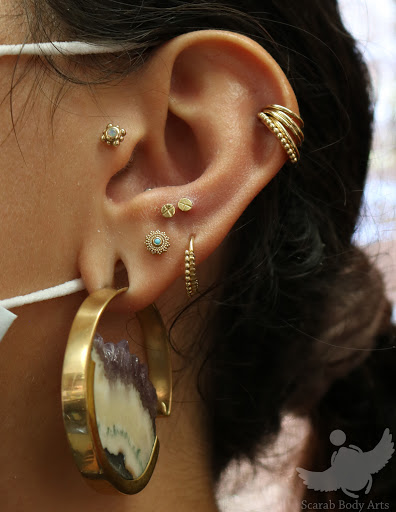 Explore cover up tattoo ideas for forearm, creative tattoo ideas in Syracuse, available at Scarab Body Arts