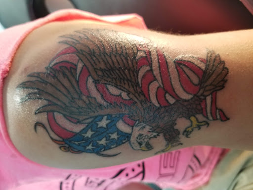 Find dog tattoo idea for your next unique tattoo in Arcade at 98 South Tattoo and Piercing