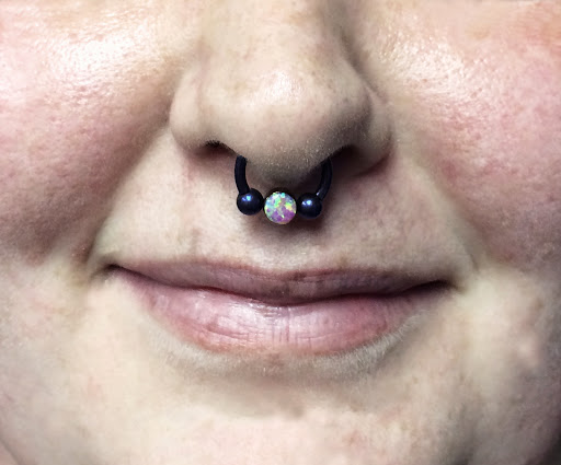 Explore hustler tattoo ideas, creative tattoo ideas in Edgewood, available at Evolved Body Arts