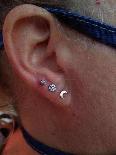 Explore mens behind ear tattoo ideas, creative tattoo ideas in Libertyville, available at Lucky Seven Tattoo