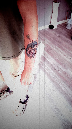 Explore yellow rose tattoo ideas, creative tattoo ideas in Lockport, available at Famous Tattoos by Pinhead