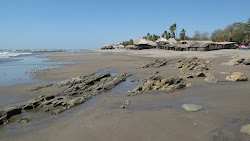 Foto von Playa La Boquita von Klippen umgeben