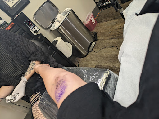 Explore red bird tattoo ideas, creative tattoo ideas in Omaha, available at Ironwood Ink