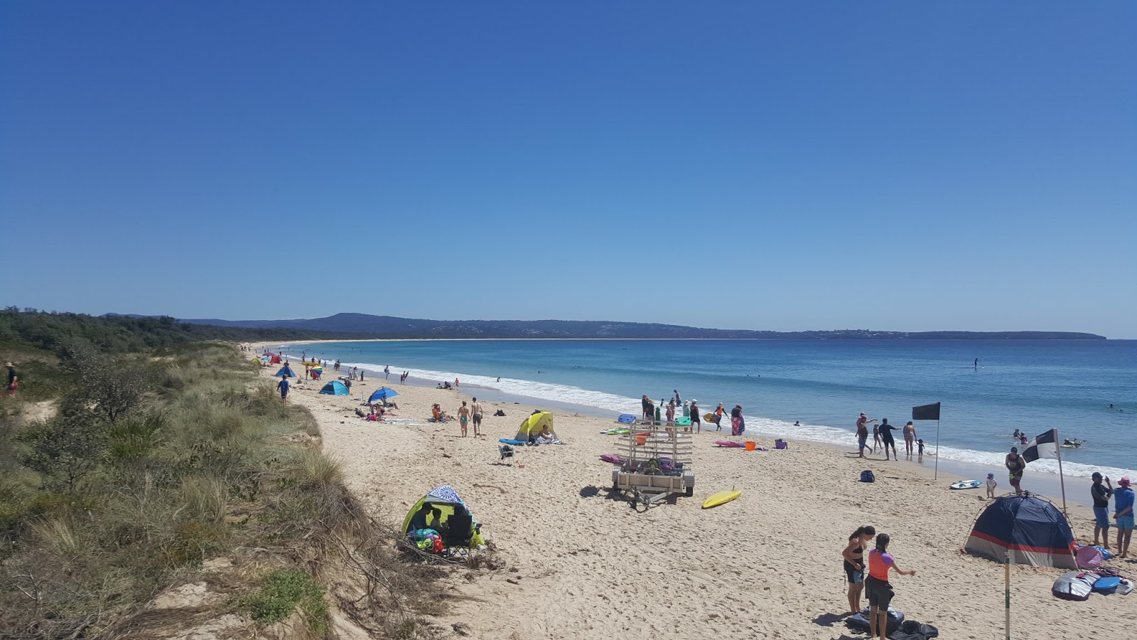 Foto di Jiguma Beach con una superficie del sabbia beige