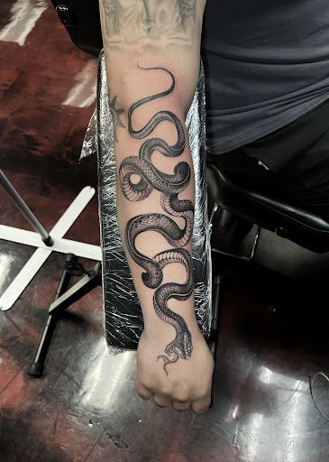 Explore ghost band tattoo ideas, creative tattoo ideas in Silver City, available at Independent Ink Tattoo