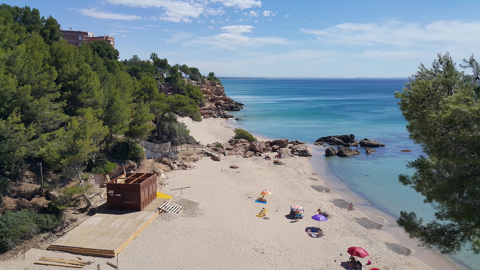 Photo of Cala de les Sirenes with bright sand surface