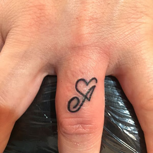 Explore twin daughter tattoo ideas, creative tattoo ideas in Chapel Hill, available at Golden Falcon Tattoo and Piercing