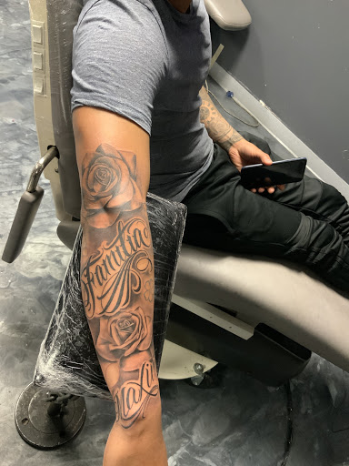 Explore son and daughter tattoo ideas for dad, creative tattoo ideas in Kansas City, available at Good Times Tattoo Studio