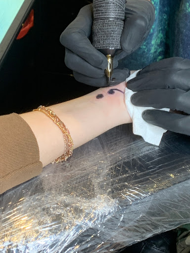 Explore feminine cross tattoo ideas, creative tattoo ideas in Hialeah, available at Fame Tattoos