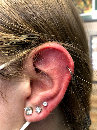Find middle boob tattoo ideas for your next unique tattoo in West Chester at Piercing by Jacqueline at X-Treme Ink Tattoo