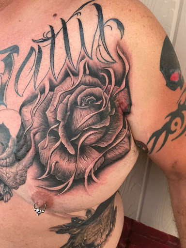 Explore atom tattoo ideas, creative tattoo ideas in Phenix City, available at Skin Traditions Tattoo Studio