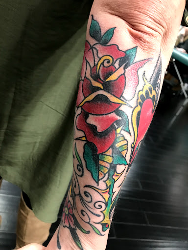 Find dragon arm tattoo ideas for your next unique tattoo in Jackson at Electric Dagger