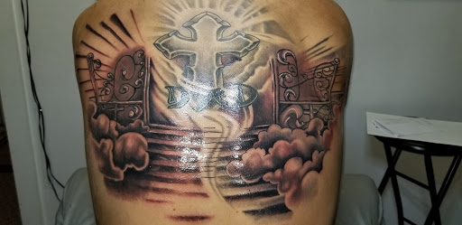 Explore forearm christian tattoo ideas, creative tattoo ideas in Angola, available at Hoodlum Ink