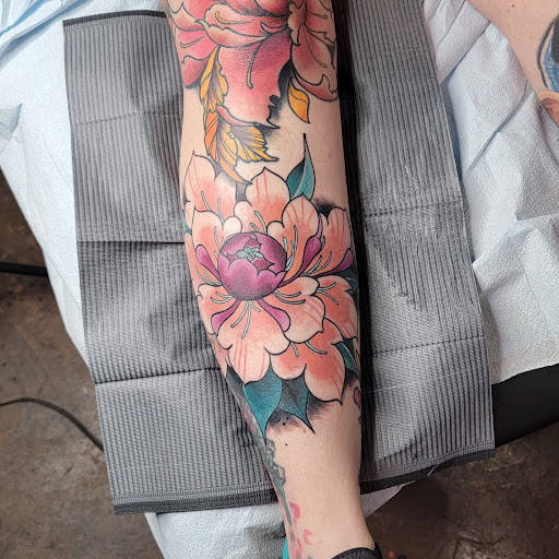 Explore love symbol tattoo ideas, creative tattoo ideas in Williston, available at Badlands Tattoo And Piercing