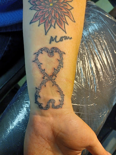 Explore flash sheets tattoo ideas, creative tattoo ideas in Owosso, available at Twisted ink tattoo