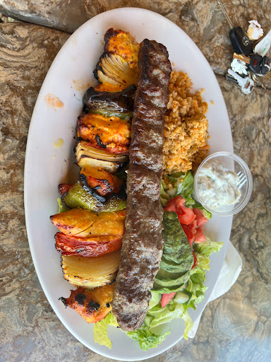 Beef Koobideh Kabob with Chicken Kabob, Romaine Avocado Salad, and Tzatziki sauce.