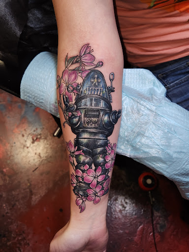 Explore cash tattoo ideas, creative tattoo ideas in Yucca Valley, available at Strata Tattoo Lab LLC