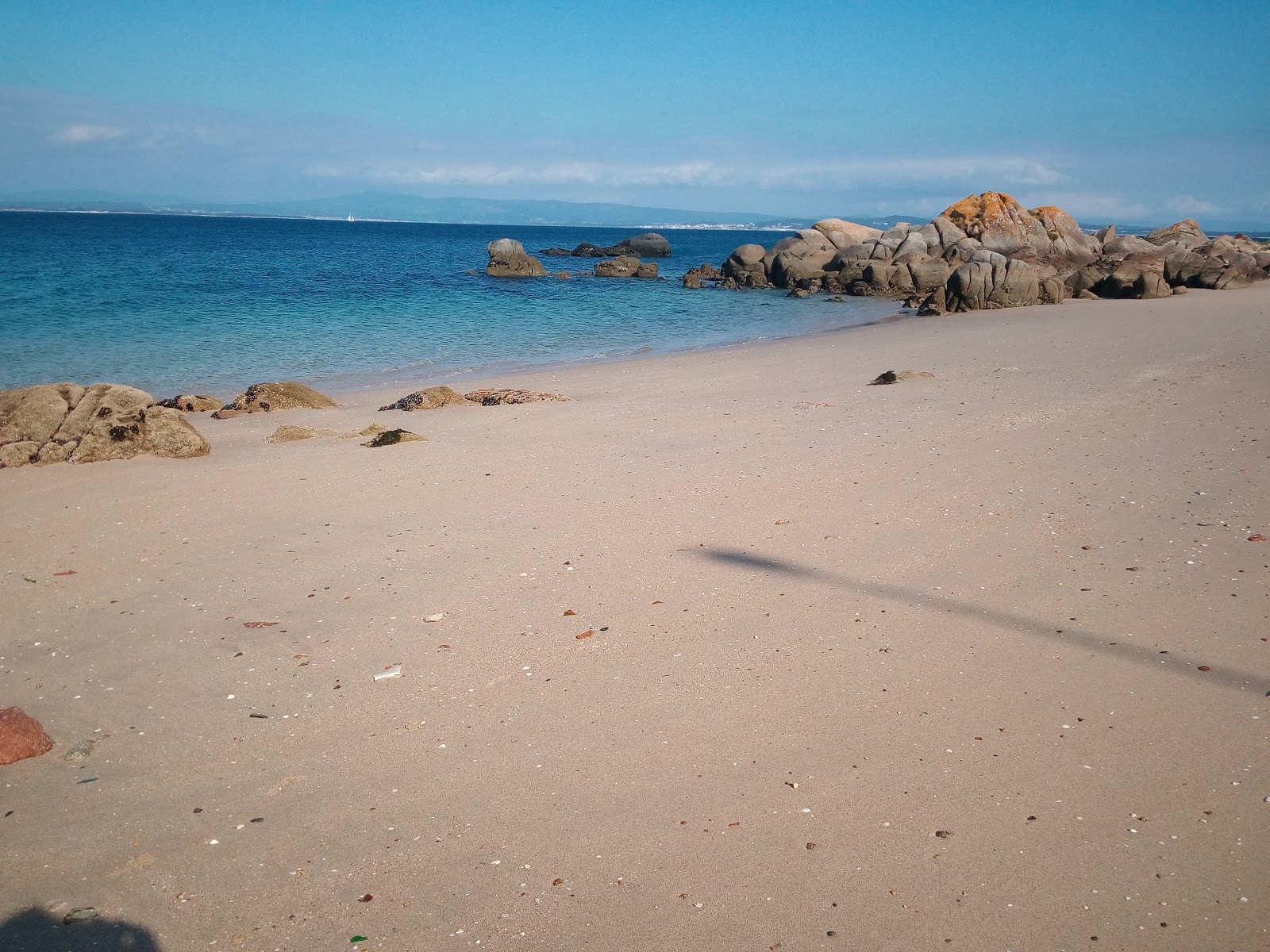 Foto di Secada beach con una superficie del acqua cristallina