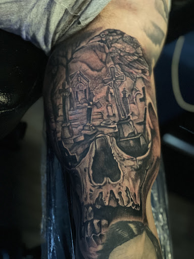 Explore haunted house tattoo ideas, creative tattoo ideas in Baltimore, available at Studio 7 Tattoo and Art Gallery