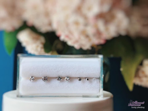 Explore ring tattoo ideas for him, creative tattoo ideas in Fargo, available at Almost Famous Body Piercing