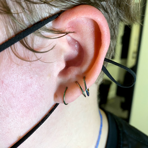 Explore meaningful elegant spine tattoo ideas, creative tattoo ideas in Louisburg, available at Purple Dot Piercings