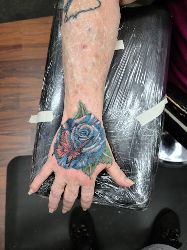 Explore black and red tattoo ideas, creative tattoo ideas in Hawthorne, available at Artistic Vision Ink Tattoo And Body Piercing