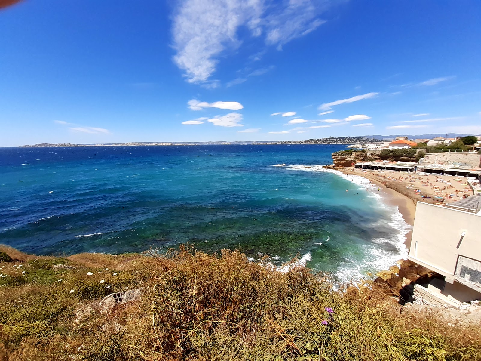 Foto di Anse des Sablettes con una superficie del sabbia con ciottolame