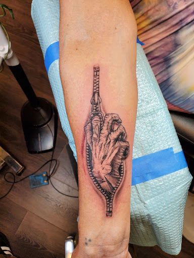 Explore tattoos behind ear ideas, creative tattoo ideas in Peoria, available at Guerrilla Ink Tattoos