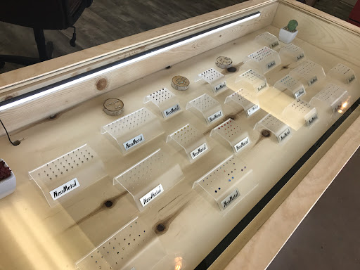 Explore postage stamp tattoo ideas, creative tattoo ideas in Brainerd, available at Red at Night Tattoos and Piercings