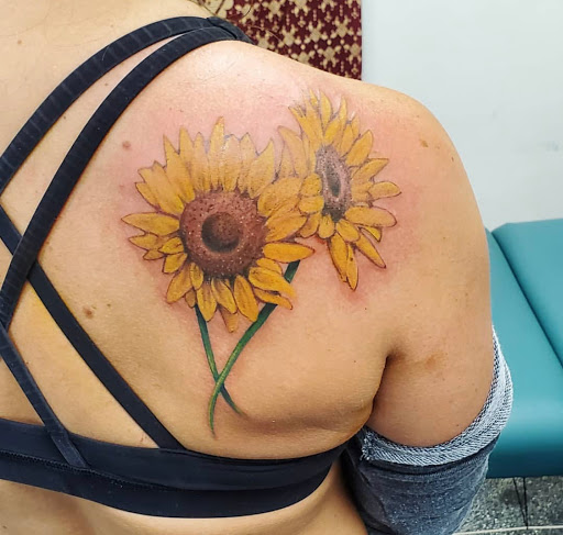 Explore sunrise tattoo ideas, creative tattoo ideas in Kenosha, available at Kenosha Tattoo Company
