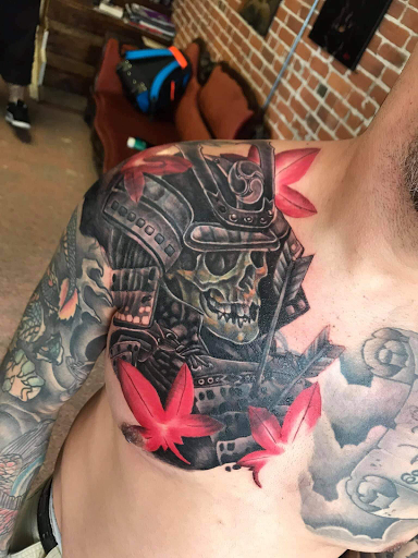 Find best tattoos ideas for men for your next unique tattoo in Springfield at Red Tip Tattoos