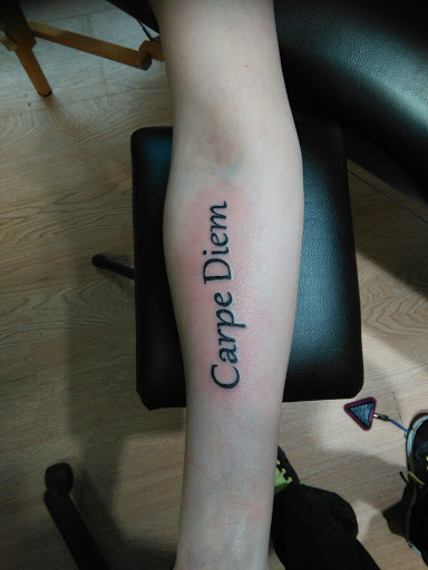 Explore rock n roll tattoo ideas, creative tattoo ideas in La Crosse, available at La Crosse Tattoo