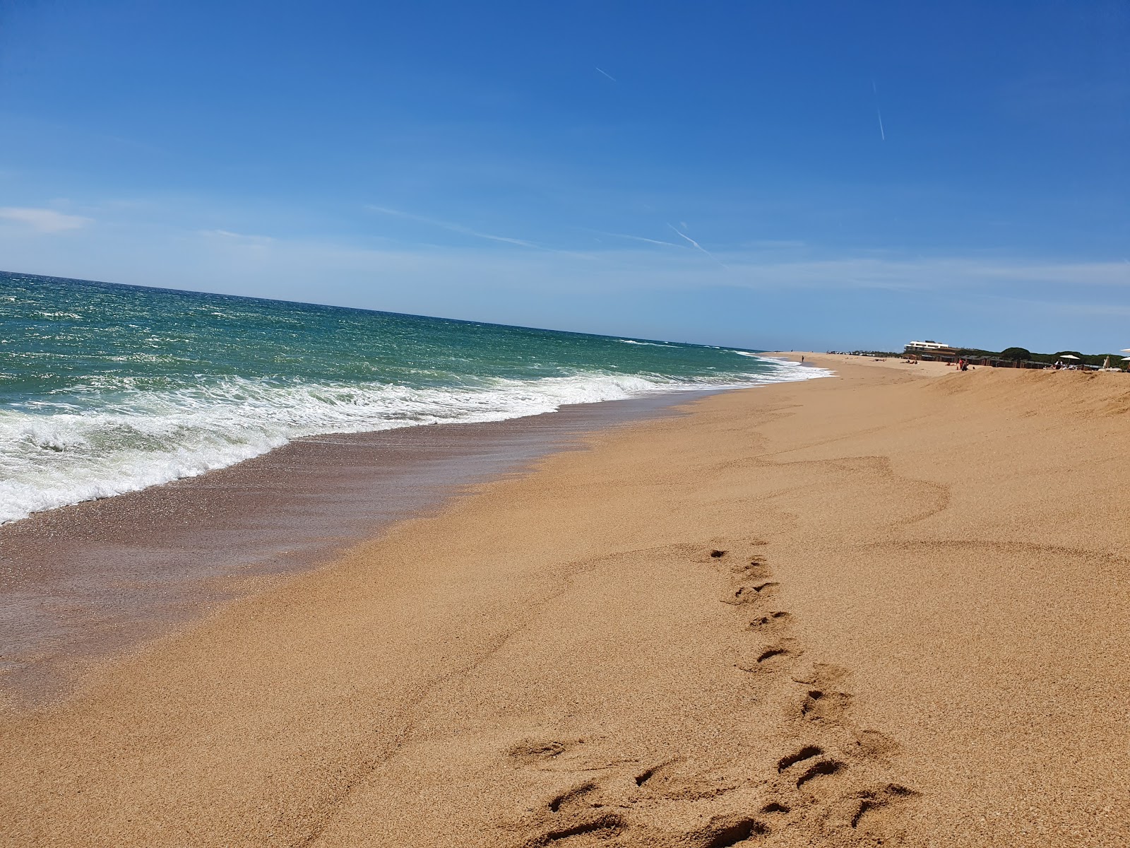 Fotografie cu Platja De Llevant cu o suprafață de nisip strălucitor